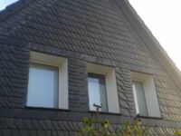 Fassadensanierung mit Moselschiefer in altdeutscher Deckung
